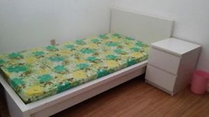 white single bed with night table.jpg