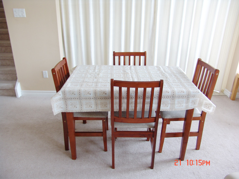 wooddiningtable with covers.jpg